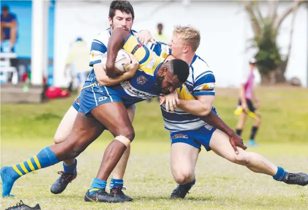  ?? Picture: BRENDAN RADKE ?? FOOTLOOSE: Kangaroos' Keba Sebasio loses his boot in the tackle match with Cairns Brothers at Stan Williams Park.