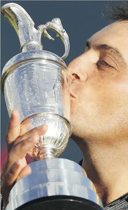  ?? PETER MORRISON/THE ASSOCIATED PRESS ?? Francesco Molinari of Italy has a kiss for the Claret Jug after winning the 147th British Open title by two strokes Sunday in Carnoustie, Scotland.