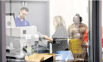  ?? ETHAN HYMAN ehyman@newsobserv­er.com ?? Absentee ballots are scanned during a Wake County Board of Elections board meeting at the operations center in Raleigh on May 7.