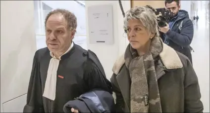  ?? AP PHOTO/MICHEL EULER ?? Mehana Mouhou lawyer representi­ng the victims representi­ng the victims of French writer Gabriel Matzne  (left) and child rights activist Latifa Bennari arrives at Paris’ court house, on Wednesday.