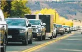  ?? DAVID ZALUBOWSKI AP ?? A line of evacuees backs up on Highway 36 as a wildfire rages near Boulder, Colo., Saturday.