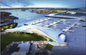  ?? FXFOWLE ARCHITECTS (VIA AP) ?? This artist rendering provided by FXFOWLE Architects shows the historic Marine Air Terminal Building, foreground, at New York’s LaGuardia Airport, and a proposed plan for connecting it to a new airport runway and terminal, center top on that would be...