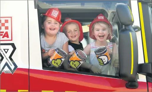  ?? Picture: PAUL CARRACHER ?? GIVE THAT THEY MAY GROW: Beth Lynch, Patrick Lynch and Bella St Clair are excited about this year’s Horsham Fire Brigade Good Friday Appeal. Fire brigade volunteers and trucks will take to the streets to collect donations from 9.30am on Friday.