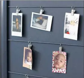 ??  ?? PICTURES OF family are clipped to a wall in the loft workspace of the “Dear White People” actor’s Silver Lake apartment.