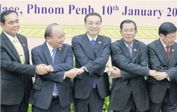  ?? AP ?? Chinese premier Li Keqiang and leaders of nations along Southeast Asia’s Mekong River gathers earlier in the year amid a push by China to build more dams that are altering the water flow downstream.