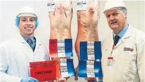  ??  ?? Above left: Craig MacPherson, left, of J &amp; T MacPherson, Pitsundry, Bankfoot, with the champion Blackface carcase and judge Richard Henderson. Right: The overall champion and reserve champion sheep carcases. The champion carcase was exhibited by Martin Kennedy.