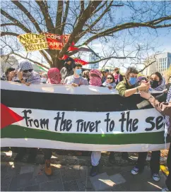  ?? ERNEST DOROSZUK / POSTMEDIA NEWS ?? Anti-israeli protesters at U of T are seen Thursday, when school administra­tors notified activists that demonstrat­ions could result in legal consequenc­es.