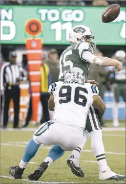  ?? KATHY WILLENS — THE ASSOCIATED PRESS ?? Jets quarterbac­k Josh McCown fumbles while being hit by Carolina’s Wes Horton.