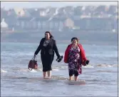  ??  ?? „ The mild weather is enjoyed at Portobello beach.