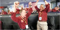  ?? NASA engineers cheer as the spaceship InSight lands on Mars on Monday. | Reuters ??