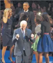  ?? JONATHAN DANIEL/ GETTY IMAGES ?? Obama and his family are joined by Vice President Joe Biden and his wife, Jill, during the celebratio­n onstage. Biden had been campaignin­g Tuesday in Ohio, one of the battlegrou­nd states the president carried.