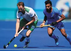  ??  ?? THE FIRST DAY OF THE GAMES: From left: Ireland’s Michael Darling and India’s Chandanda Thimmaiah fight for the ball during the men’s field hockey India v Ireland match; Padraig McCarthy of Ireland on ‘Simon Porloe’ in the dressage competitio­n; Nicolas...