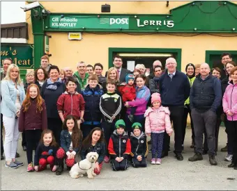  ??  ?? Locals outside the Kilmoyley Post Office at Lerrig Cross during the recent protest over the threat to its future. The community welcomed news this week it is to stay open for at least six months.