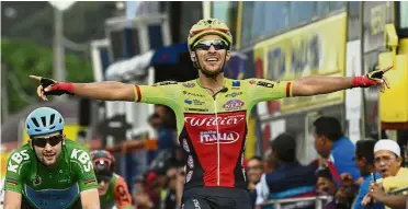  ?? — Bernama ?? Sweet victory: Luca Pacioni celebrates after crossing the finish line during Stage 6 of the Le Tour de Langkawi in Tanjung Malim yesterday.