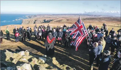  ??  ?? Islay community members gather at the Mull of Oa to remember those who lost their lives 100 years ago when the SS Tuscania sank off between Islay and Rathlin Island.