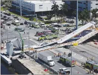  ?? AP PHOTO ?? Emergency personnel respond after a brand-new pedestrian bridge collapsed onto a highway at Florida Internatio­nal University in Miami on Thursday. The pedestrian bridge collapsed onto the highway crushing multiple vehicles and killing several people.