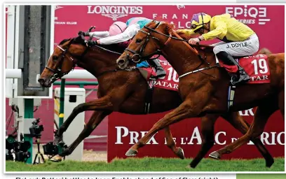  ??  ?? Flat out: Dettori battles to keep Enable ahead of Sea of Class (right)