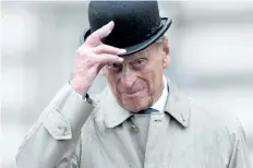 ?? YUI MOK/AFP/GETTY IMAGES ?? Prince Philip, the 96-year-old husband of Queen Elizabeth II, conducted his final solo public engagement on Wednesday, overseeing a military parade in the pouring rain before retiring from a lifetime of service.