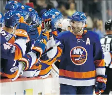  ?? KATHY WILLENS/THE ASSOCIATED PRESS ?? With strict enforcemen­t, defencemen like Johnny Boychuk have been taking faceoffs more than ever.