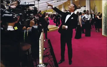  ?? ASSOCIATED PRESS ARCHIVES ?? Concord native Tom Hanks arrives at the Oscars in Los Angeles in February. The 2021 Academy Awards ceremony, scheduled for April 25, and other awards shows may look a lot different because of the COVID-19 pandemic.