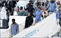  ?? PICTURE: ORIETTA SCARDINO/ANSA ?? Migrants disembark from the Italian Coast Guard ship Diciotti with 900 rescued migrants and two bodies in Catania, Italy, yesterday.