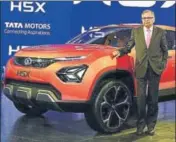  ?? AFP PHOTO ?? Tata Motors chairman N Chandrasek­aran poses with the newly launched H5X car in Greater Noida on Wednesday.