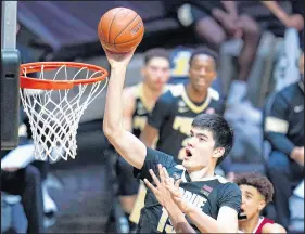  ?? MICHAEL CONROY/AP ?? Purdue center Zach Edey scores two of his 20 points against Indiana on Saturday.