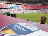  ?? MATTHIAS SCHRADER/AP ?? Workers prepare a sign Wednesday inside the FC Bayern Munich soccer stadium Allianz Arena in Munich, Germany.