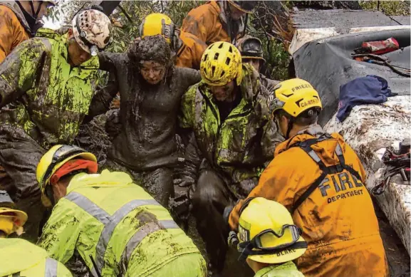  ?? Tom Piozet 2018 ?? Firefighte­rs rescue author Kim Cantin’s daughter Lauren from a mudslide in Montecito on Jan. 9, 2018. Lauren was trapped 6 hours under 20 feet of mud and more.