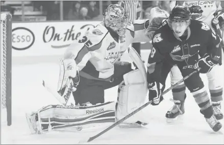  ?? Photos/gavin Young/calgary Herald ?? The Hitmen’s rookie defenceman Jake Virtanen, shown here skating around Lethbridge goalie Ty Rimmer, has been playing like a veteran.