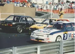  ??  ?? The Nissan-Mobil 500 introduced top-class internatio­nal touring car racing to New Zealand for the first time. Ian Tilley provides us with a glimpse of the action from the 1987 race 1. The no. 2 Mobil HDT-Commodore slips past a damaged BMW M325i and...