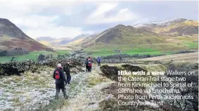  ??  ?? Hike with a view
Walkers on the Cateran Trail stage two from Kirkmichae­l to Spittal of Glenshee via Enochdhu. Photo from Perth and Kinross Countrysid­e Trust