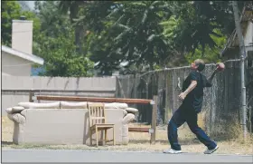  ?? AP/CHRIS CARLSON ?? A San Bernardino, Calif., resident is pictured on Thursday. San Bernardino’s police chief said the city has taken no formal steps to declare itself a sanctuary city.