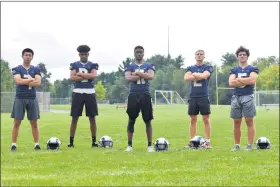  ?? AUSTIN HERTZOG - MEDIANEWS GROUP ?? The Spring-Ford football team will be led this fall by, from left, Andrew Yoon (7), Nate Capers (8), Naphtali Stine (11), Mason Brill (2) and Nick Teets (5). Below, Spring-Ford seniors Ryan Beppel, left, Kyle Kennedy, center, and Josh Hellauer will lead the Rams on the lines this fall.