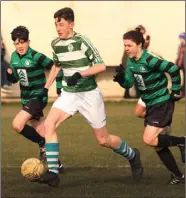  ??  ?? Darragh Farrell of Shamrock Rovers is pursued by Gorey Celtic duo Cian Hughes and Josh Whyte.