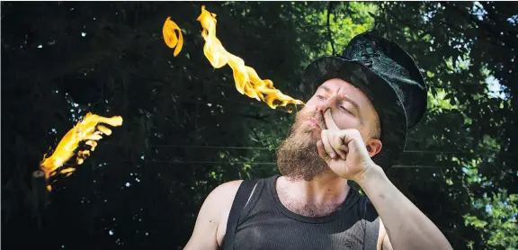  ?? PHOTOS: ASHLEY FRASER ?? Shade Flamewater of Flamewater Circus teaches neophytes seeking excitement the precise and fluid motions required to become a successful fire eater.