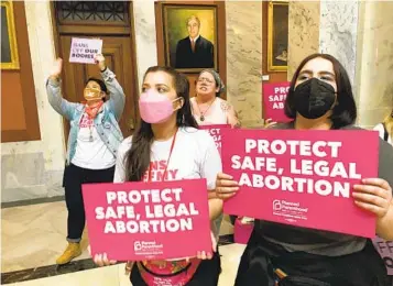  ?? BRUCE SCHREINER AP FILE ?? Abortion rights supporters protest in April at the Kentucky Capitol in Frankfort. Kentucky voters last week rejected amending the state constituti­on to declare that it does not protect the right to an abortion.