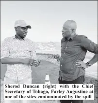  ?? ?? Sherod Duncan (right) with the Chief Secretary of Tobago, Farley Augustine at one of the sites contaminat­ed by the spill