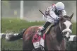  ?? SETH WENIG - STAFF, AP ?? In this June 20, 2020, file photo, Tiz the Law (8), with jockey Manny Franco up, approaches the finish line on his way to winning the 152nd running of the Belmont Stakes horse race in Elmont, N.Y.