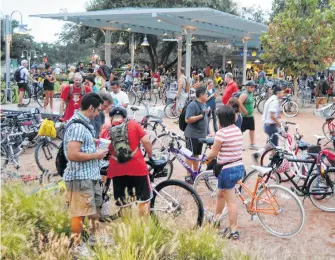  ??  ?? Bikers gather in Market Square Park for the Critical Mass bike ride.