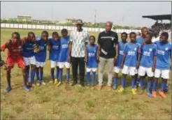  ?? ?? The celebrant with the football team