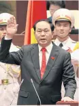  ??  ?? TOP JOB:Tran Dai Quang takes the oath after being elected President yesterday.