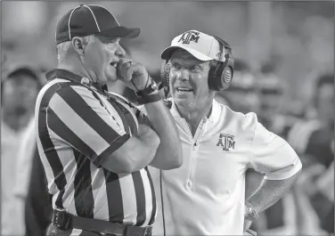  ?? Associated Press ?? Discussing matters: In this Saturday, Sept. 15, 2018, file photo, Texas A&amp;M head coach Jimbo Fisher argues a call with an official during the second half of a game against Louisiana-Monroe in College Station, Texas. The Aggies take on Arkansas today in Arlington, Texas.