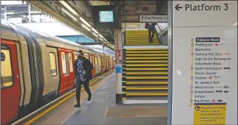  ??  ?? A man runs down the platform at Edgware Road Undergroun­d station.