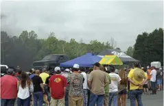  ??  ?? Crowds flocked around the Dan’s Diesel Performanc­e mobile chassis dyno to see truck after truck put down big numbers.