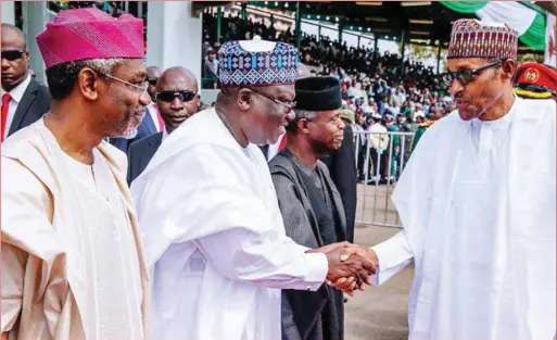  ??  ?? Buhari in a handshake with Lawan