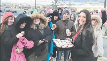  ?? William Bloxsom / Hearst Connecticu­t Media ?? The opening of a Next Generation Dunkin’ draws a crowd to the shop in Milford Friday.