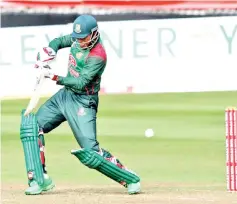  ??  ?? Soumya hits 66 as Bangaldesh powered to victory. — AFP photo