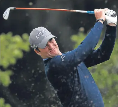  ?? Picture: Getty. ?? Marc Warren hits his tee shot on the seventh. A 67 left him four shots off the lead.