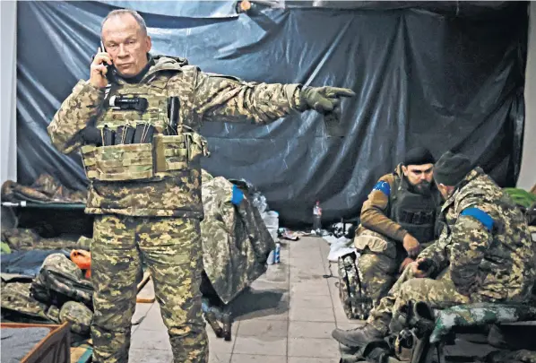  ?? ?? Oleksandr Syrskyi, Commander of the Ukrainian army, gives instructio­ns in a shelter in Soledar, the site of heavy battles with the Russian forces and at risk of being overwhelme­d